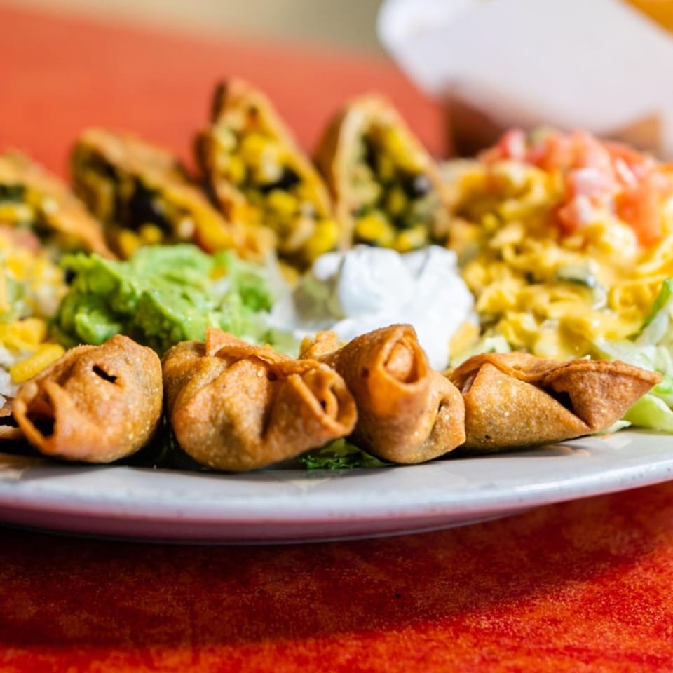 Maria's Mexican Restaurant's crispy fried wontons with guacamole, sour cream, and corn salsa.